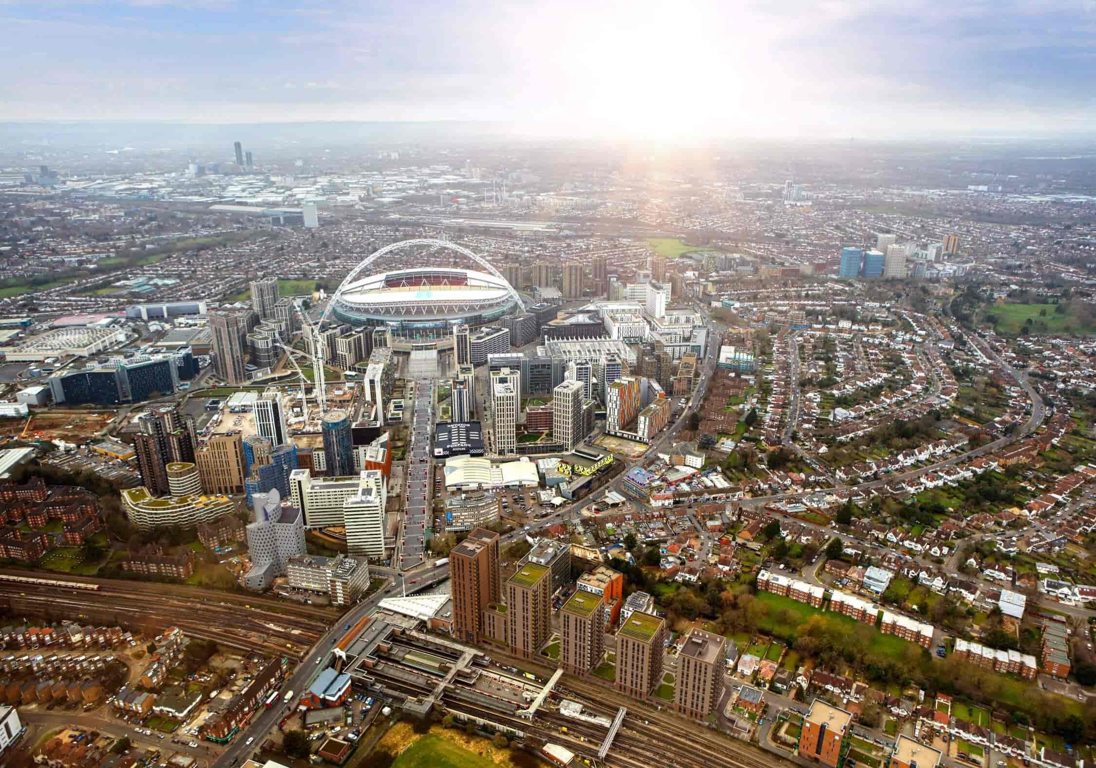 An aerial view of the city of London, showcasing its iconic landmarks and bustling streets