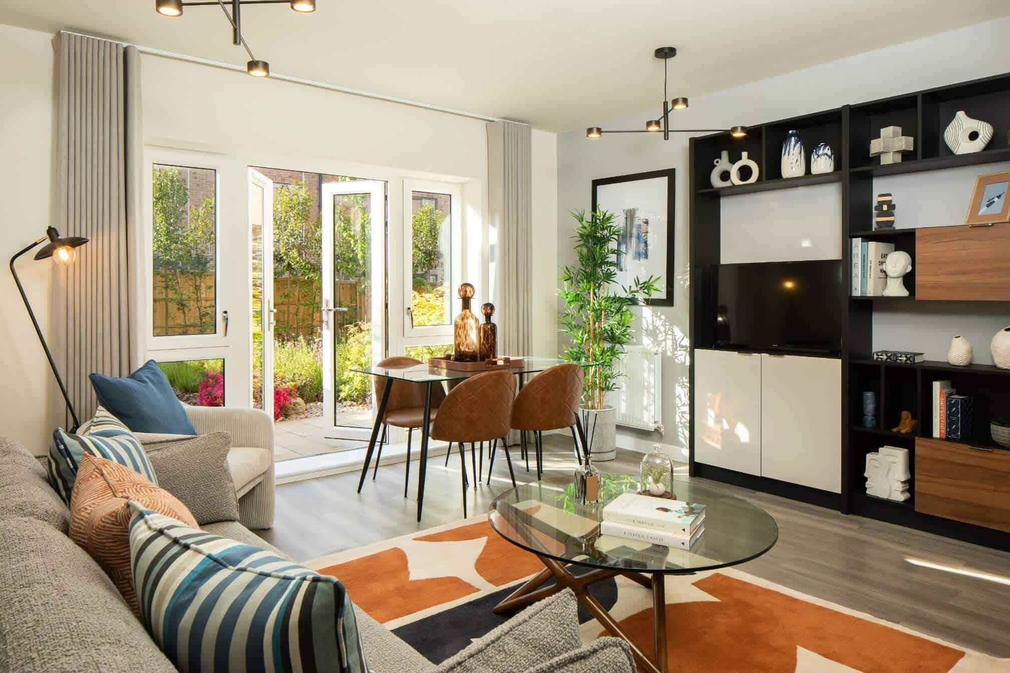 A living room with a dining table and chairs in the Springfield Place Development