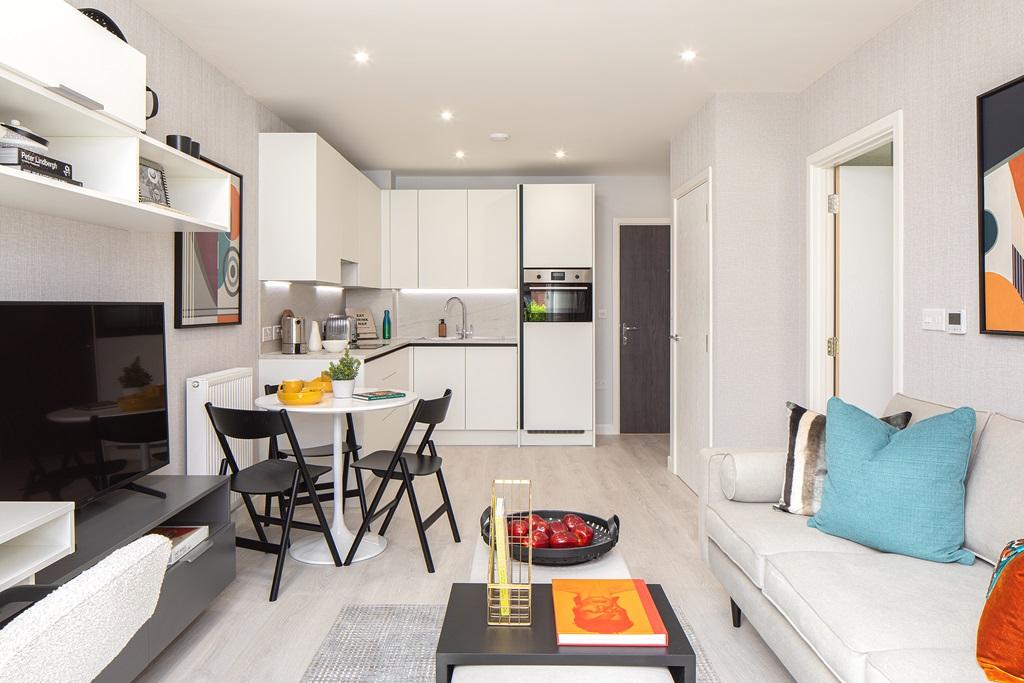 A living room and kitchen in an Eastman Village apartment