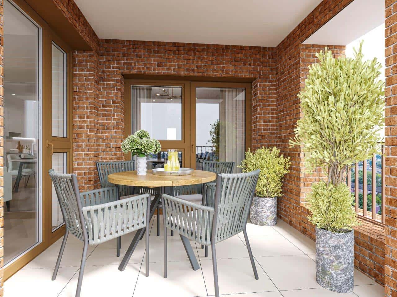 A balcony with a table and chairs at Bermondsey Heights Homes in London