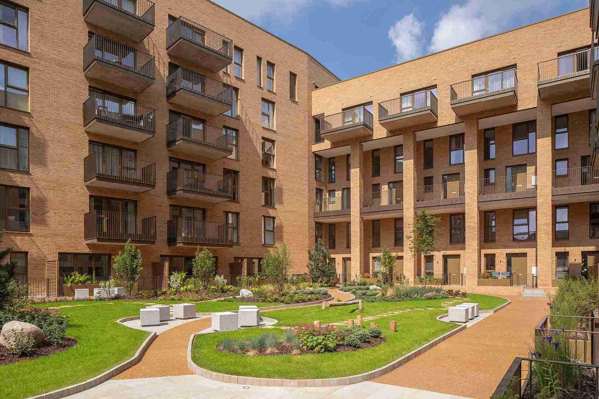 Hendon Waterside Homes, features a charming courtyard within its large apartment building